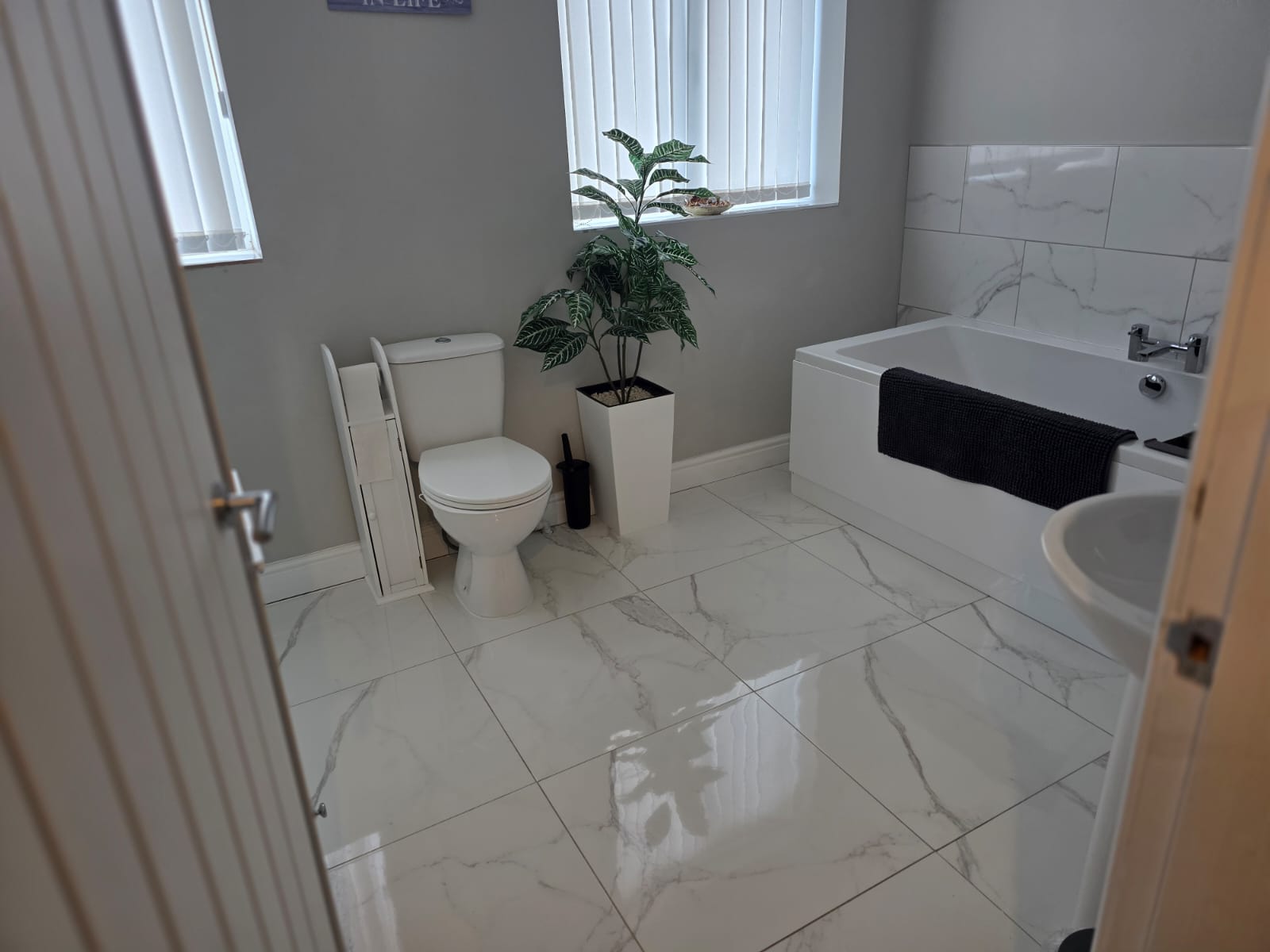 Pristine bathroom with marble floor tiles